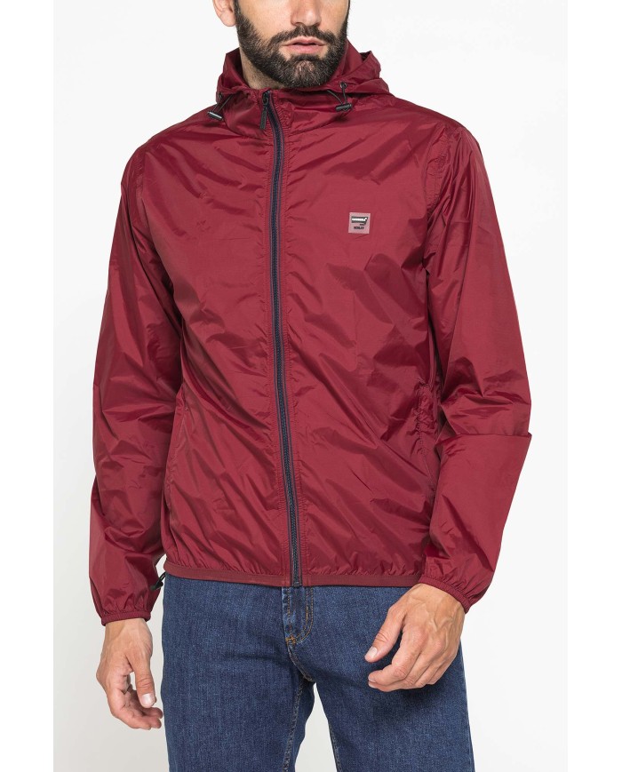 GIUBBINO ANTIVENTO TASCABILE CON ZIP E CAPPUCCIO